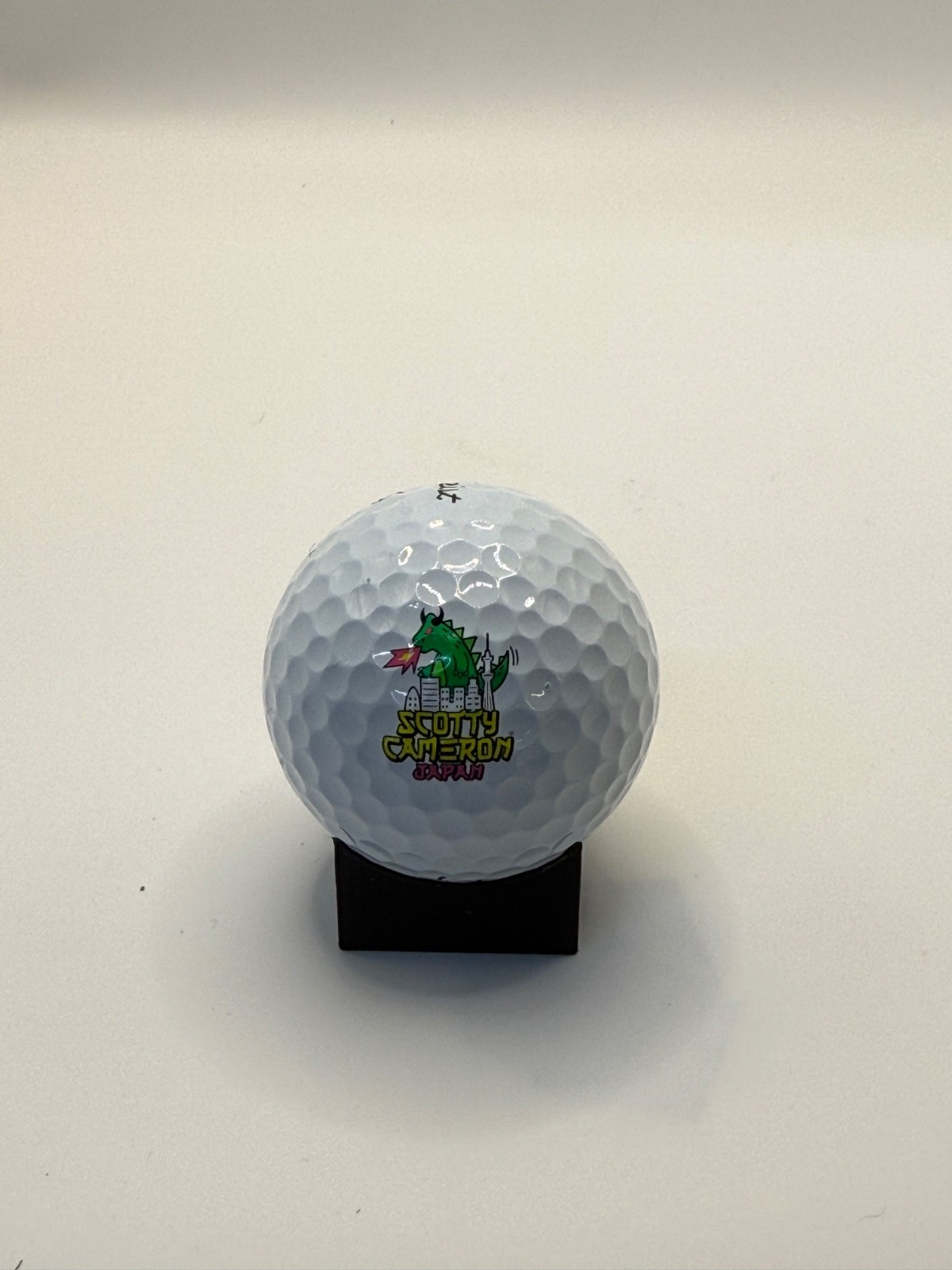 Scotty Cameron Godzilla (Dogzilla) Pro V1 Logo Ball — Yellow/Pink